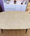 Fitted Oval Vinyl Tablecloth With Flannel Backing And Elastic Edges on oval table, showing waterproof and oil-proof PVC surface