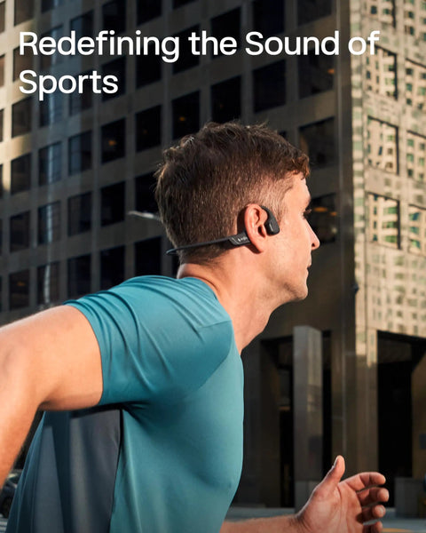 Next Level Open Ear Bone Conduction Bluetooth Sport Headphones In Black worn by a runner in a city, showcasing comfort and style.