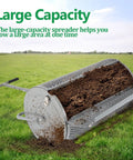 27 Inch Metal Roller Garden Spreader For Lawn And Topsoil With Adjustable Handle in use spreading soil on grass