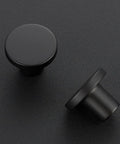 30 Pack Matte Black Cabinet Knobs And Drawer Pulls, Solid Zinc Alloy, 1.18 Inch Top Diameter, 0.5 Inch Base, 0.86 Inch Height, For Cabinets, Dressers And Closets, Durable Modern Hardware To Upgrade Your Cabinet Look, close-up and angled view