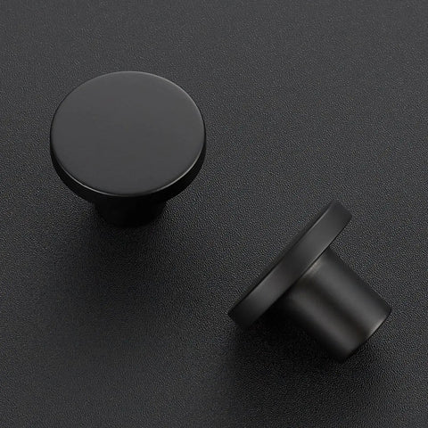 30 Pack Matte Black Cabinet Knobs And Drawer Pulls, Solid Zinc Alloy, 1.18 Inch Top Diameter, 0.5 Inch Base, 0.86 Inch Height, For Cabinets, Dressers And Closets, Durable Modern Hardware To Upgrade Your Cabinet Look, close-up and angled view