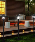 40 Inch Solar Lamp Post Lights Outdoor Vintage Street Vibe for Lawn Pathway Driveway Front and Back Door Pack of 2 Weatherproof Rust Resistant Solar Powered Garden Lights with Auto On at Dusk for Walkways and Entrances No Wiring Needed illuminating a patio area.