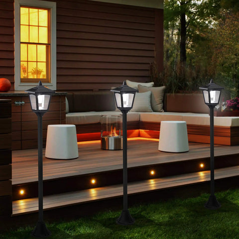 40 Inch Solar Lamp Post Lights Outdoor Vintage Street Vibe for Lawn Pathway Driveway Front and Back Door Pack of 2 Weatherproof Rust Resistant Solar Powered Garden Lights with Auto On at Dusk for Walkways and Entrances No Wiring Needed illuminating a patio area.