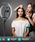 Makeup artist using 12 Inch Ring Light With 72 Inch Tripod Stand Dual Phone Holders 38 Color Modes Selfie Ring Light for video