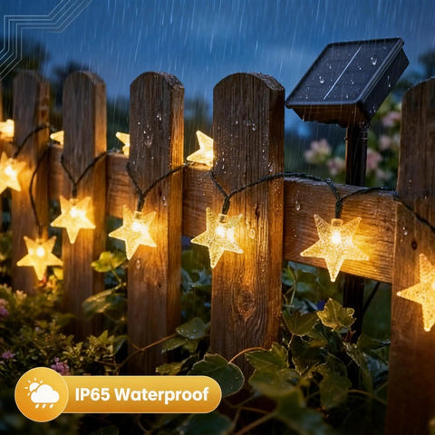 Solar Star String Lights 39Ft Outdoor Waterproof Fairy Lights with 100 LEDs on a wet wooden fence at night, IP65 rating visible
