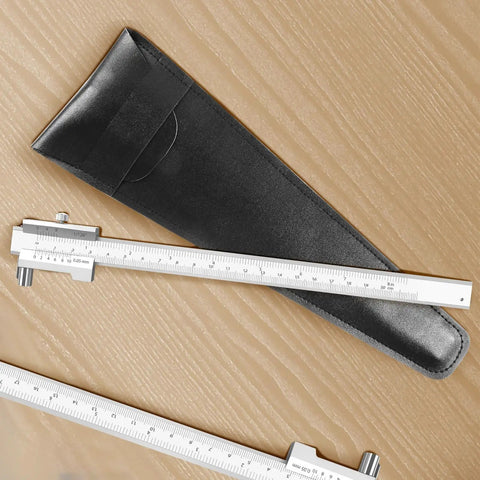 Heavy Duty 8 Inch Stainless Steel Scriber Caliper With Raw Hardened Carbide Scribe Needles next to a protective case on wood surface.