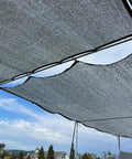 Reflective Aluminet Shade Cloth 70 Percent UV Block Heat Shield installed outdoors over frames