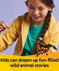 Girl enjoying the Awesome Building Kit Featuring Rad Spider Scorpion And Snake Models, holding a colorful spider model.