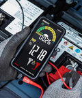 Rechargeable Digital Multimeter With Auto And Manual Range In Smart Auto Mode being used for car battery testing