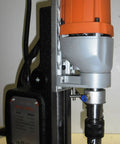Heavy Duty Magnetic Drill Press That Is A Total Knockout With Six Piece Annular Cutter Set For Badass Steel Jobs And Quick Setup On Any Job Site close-up showing motor and drill bit.