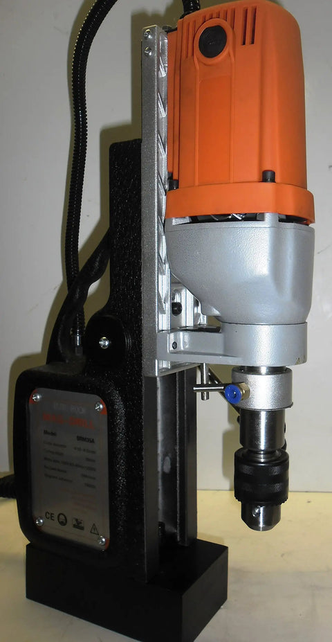 Heavy Duty Magnetic Drill Press That Is A Total Knockout With Six Piece Annular Cutter Set For Badass Steel Jobs And Quick Setup On Any Job Site close-up showing motor and drill bit.