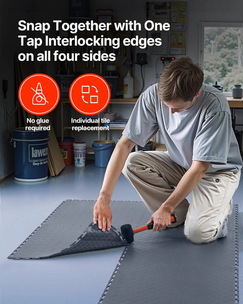 Interlocking Garage Floor Tiles 16 Pack, Diamond Plate Texture Non Slip PVC Floor Mats, 20.2x20.2x0.2 Inches, Graphite Gray, Quiet, Durable, DIY Friendly, Easy Install for Garages, Workshops, and Warehouses. Man installing graphite gray PVC garage floor tile with mallet