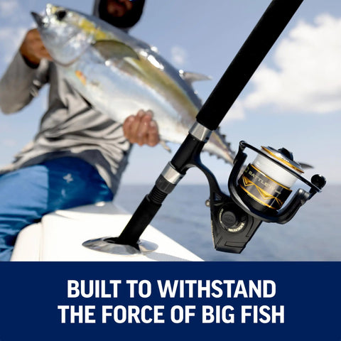 Battle IV Size 4000 Spinning Fishing Reel with full metal body mounted on rod, fisherman holding a large fish