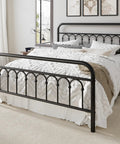 Rock Solid Queen Size Metal Platform Bed Frame With Victorian Scrollwork Headboard Straight Up Classic Look Plus Legit Vintage Charm For Cozy Master Bedrooms Black Finish in a modern bedroom.