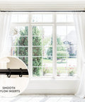 Top Tier Premium Metal Curtain Rings With Quiet Smooth Removable Nylon Inserts Pinhooks And Clips Included One Point Five Inch Inside Diameter 18 Rings For Two Standard Curtains Ultra Sleek Tuxedo Black on white curtains over a wide window background