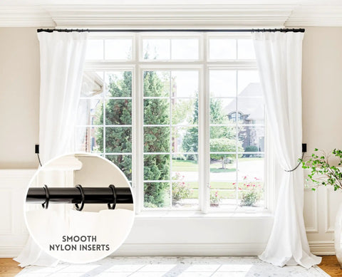 Top Tier Premium Metal Curtain Rings With Quiet Smooth Removable Nylon Inserts Pinhooks And Clips Included One Point Five Inch Inside Diameter 18 Rings For Two Standard Curtains Ultra Sleek Tuxedo Black on white curtains over a wide window background