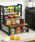 Industrial Rustic Tea Bag Organizer, 3 Tier Wood Storage Box With Drawer on countertop holding tea bags and jars.