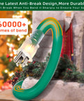 Image showing green heavy-duty Outdoor Extension Cord 150 Ft With 1 To 3 Splitter, 3 Outlets, 16 AWG, bent, next to Christmas decor.