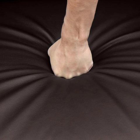 Close-up of a hand pressing into cushy brown PU leather on Comfy Padded Seat Recliner Chairs Set Of 2 For Home Theater