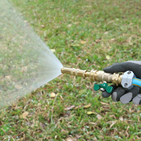 All Metal Garden Hose Repair Connector Kit With Aluminum Mender Fittings in use, spraying water onto grass