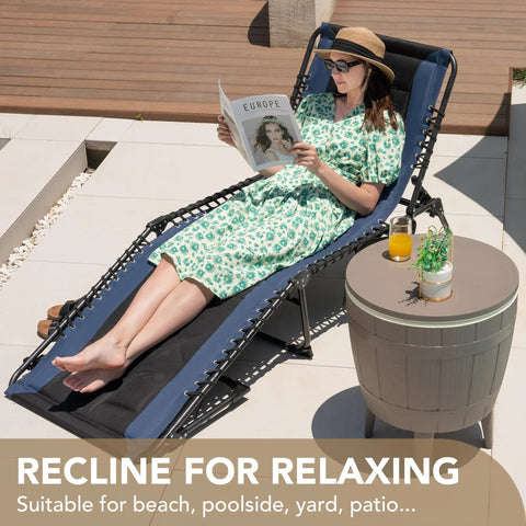 Woman relaxing on a 4 Fold Padded Portable Outdoor Chaise Lounge Chair With Pillow and Side Pocket for patio use, blue recliner.