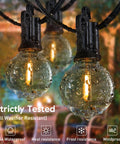 Outdoor String Lights Hanging Globe Patio Lights With 50 G40 Shatterproof Bulbs And Two Spare No Fuss Plug And Play Waterproof Connectable Commercial Grade 50 Light Strand For Indoor And Outdoor Decor shown in rain demonstrating waterproof feature.