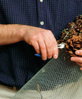 Person working with 24 Inch By 50 Feet 23 Gauge Galvanized Hardware Cloth With Quarter Inch Openings for garden projects