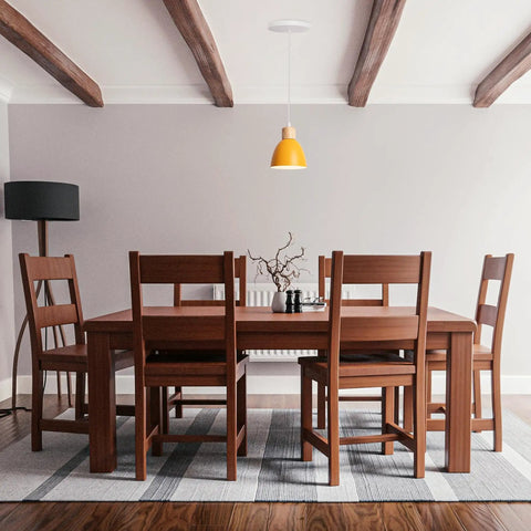 Kiven Instant Light Conversion Kit for 4/5/6inch Hole hanging from ceiling over a wooden dining table in a cozy room.