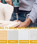 Person using a drill to install a screw into wood, highlighting multi-wall applications like wooden, drywall, plasterboard, and lime wall.