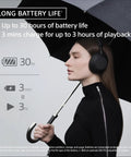 Person wearing Top Tier Noise Canceling Wireless Headphones With HD NC Processor QN3, 30 Hour Battery Life, holding umbrella