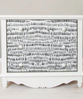 White dresser with Peel And Stick Grey Speckle Brushstroke Wallpaper For Easy Diy Decor, Repositionable and Removable on drawers.