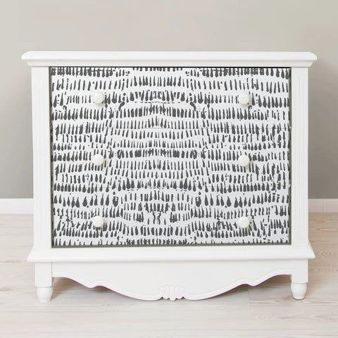 White dresser with Peel And Stick Grey Speckle Brushstroke Wallpaper For Easy Diy Decor, Repositionable and Removable on drawers.