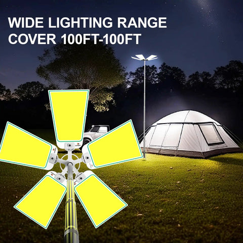 30,000 Lumen Telescoping Camping Light With Remote And Manual Control illuminating a tent in a field at night
