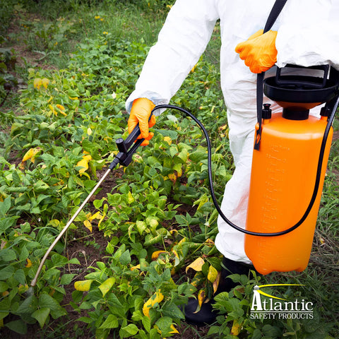 Outrageous Orange Heavy Duty Disposable Nitrile Gloves 8 Mil Latex Free shown for garden spray use.