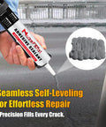Heavy Duty Gray Concrete Crack Filler Self Leveling Waterproof Sealant Fast Curing Flexible Cement Repair Patch Kit For Driveways Walkways Rock Solid Fix For Cracks Up To 2 Inches Wide Fast Cure For Diy 2 Pack 10 1 Ounce Each being applied from a caulking gun.