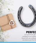 Authentic Handmade Cast Iron Horseshoe Wall Decor Heavy Duty Good Luck Charm Wedding Present Includes Hardware next to gift.