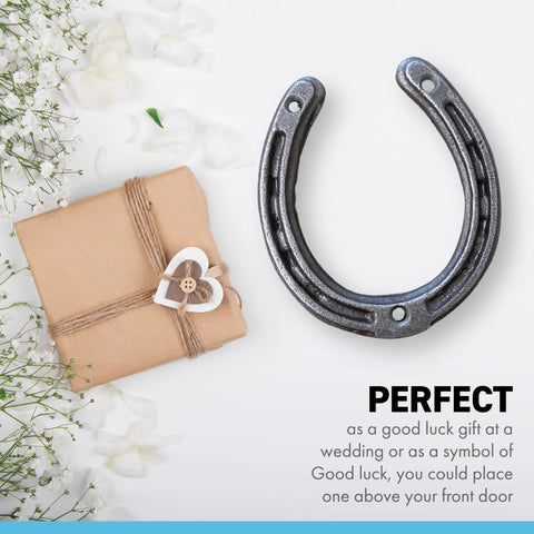 Authentic Handmade Cast Iron Horseshoe Wall Decor Heavy Duty Good Luck Charm Wedding Present Includes Hardware next to gift.