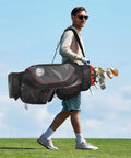 Man walking on golf course carrying Top Tier Lightweight Golf Cart Bag With Next Level 15 Way Organizer Top and clubs.