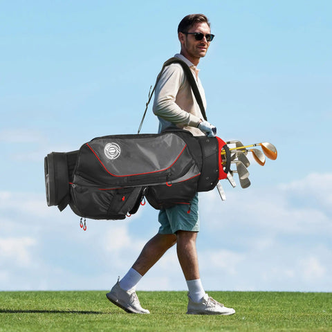 Man walking on golf course carrying Top Tier Lightweight Golf Cart Bag With Next Level 15 Way Organizer Top and clubs.