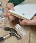 Installation of 10 Piece Plastic Locking Shelf Pegs ABS Pins for cupboards, showing drill and protective plastic cover.