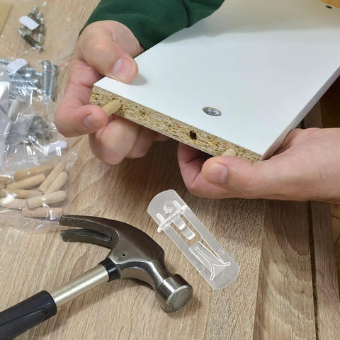 Installation of Durable Plastic Shelf Support Clips 10 Pack ABS Shelf Pins No Tools Needed shown with hammer and wood panel