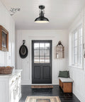 11 Inch Semi Flush Mount Ceiling Light With Industrial Vibe Matte Black Exterior And White Interior One Light Fixture in hallway.