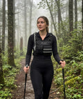 Person hiking in forest wearing 12L Hydration Running Vest for Men With On the Go Storage for Running and Cycling
