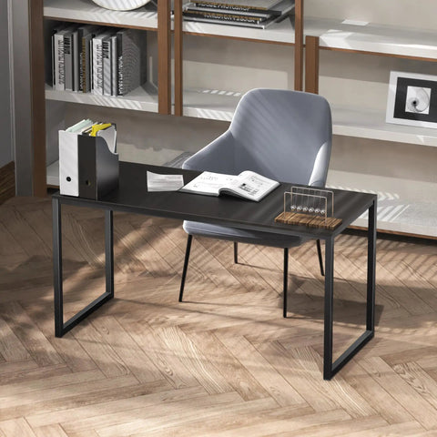 Space Saving 40 Inch Home Office Desk For Computer Setup Black Durable Powder Coated Steel Frame Ideal For Small Rooms Dorms And Home Offices Fits Laptop Monitor And Essentials With A Clean Sleek Look, shown in an office setting with chair and bookshelves.