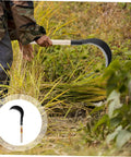Gardener using Multi Purpose Manganese Steel Garden Tool With Wooden Handle For Grass Cutting, Weeding, and Harvesting on grass.