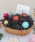 Hassle Free Black Crinkle Cut Paper Shred Filler For Gift Baskets And Boxes Smooth Cushion Wrapper with decorative balls.