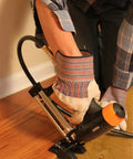 Person using Pro Grade Pneumatic 20 Gauge L Cleat Flooring Nailer For Tongue And Groove DIY Friendly Hardwood Installs.