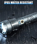 Beastly Bright 200000 Lumen Rechargeable LED Flashlight With LCD Display in rain demonstrating IP65 water resistance