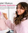 Totally Dope Pink Bow Adhesive Wall Hooks With Heavy Duty Grip Strips For Drama Free Peel And Stick Mounting and a person hanging a bag