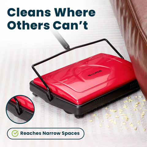 No Sweat Push Powered Carpet Sweeper With Triple Brush Heads For Big Time Dust Pickup On Area Rugs And Vinyl Floors grabs debris near couch.
